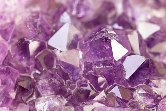 Amethyst gemstones on white background