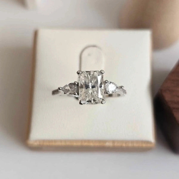 Diamond ring in a box on a light background