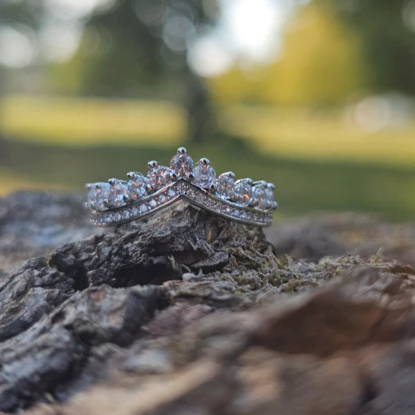 Diamond ring on a tree branch with a blurred natural background