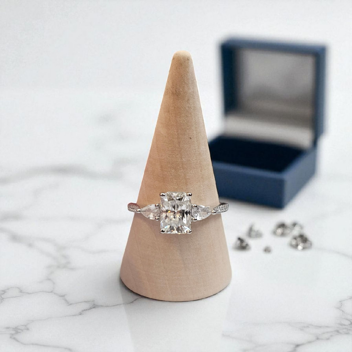 Diamond ring on a wooden cone with a marble background