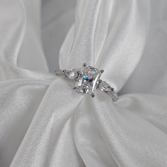 Diamond ring on a white fabric background