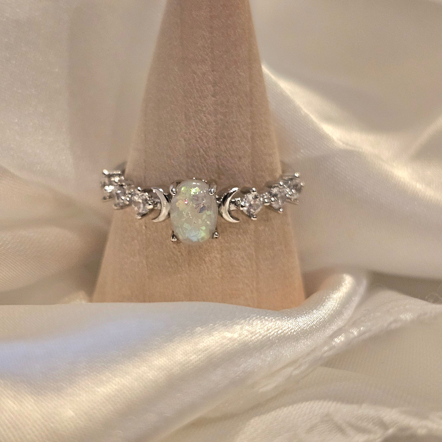 Opal riing on silk background