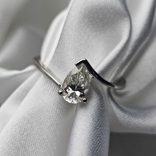Diamond ring on a white fabric background