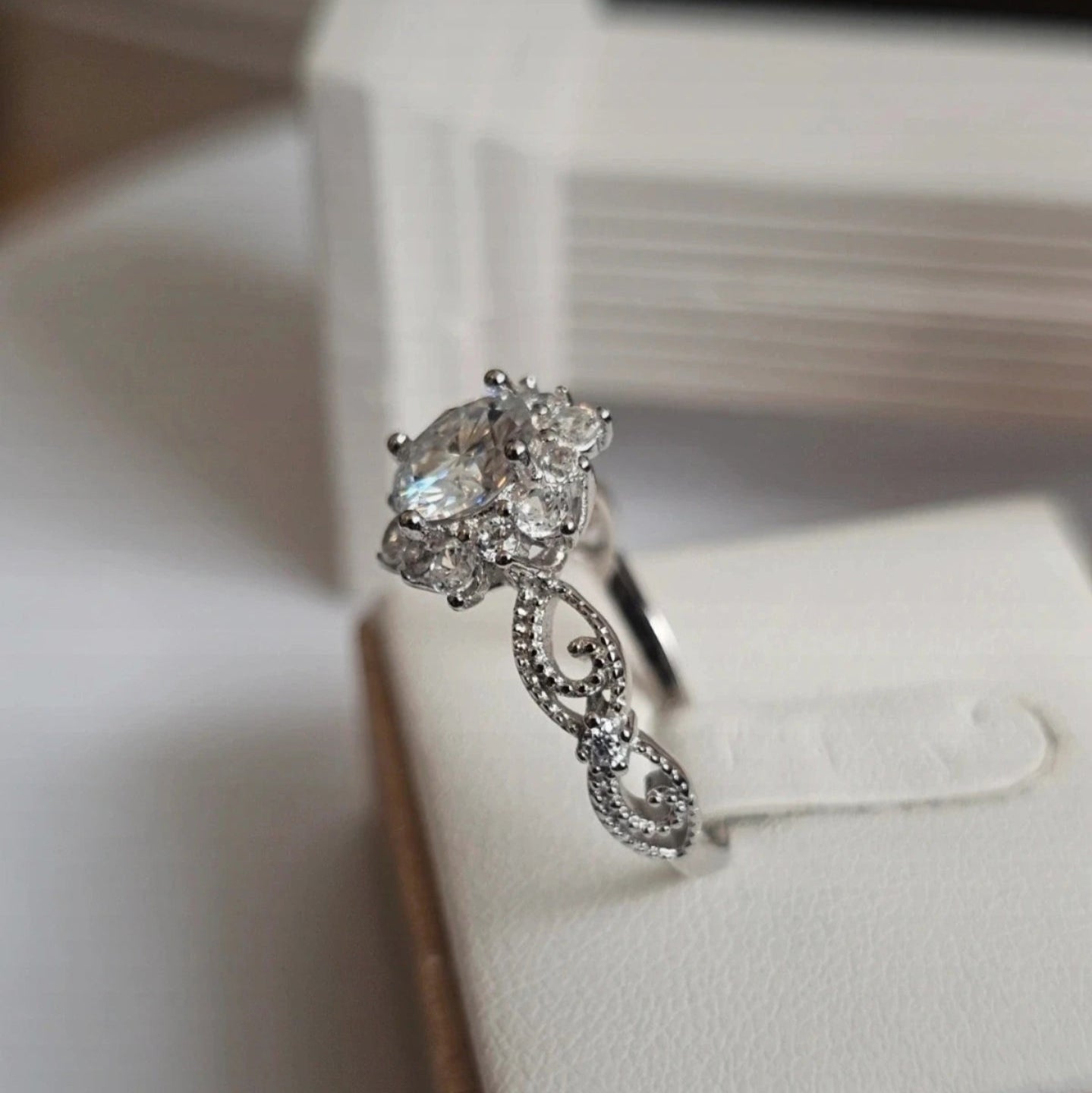 Diamond ring on a white jewelry box