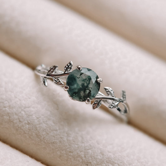 Moss agate ring with natural green patterns and sterling silver leaf band