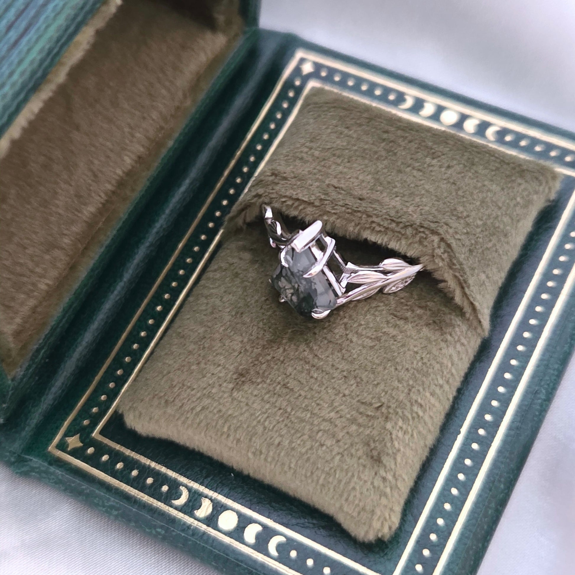Olive Grove natural moss agate ring in 925 sterling silver with platinum plating, presented in a green celestial gift box