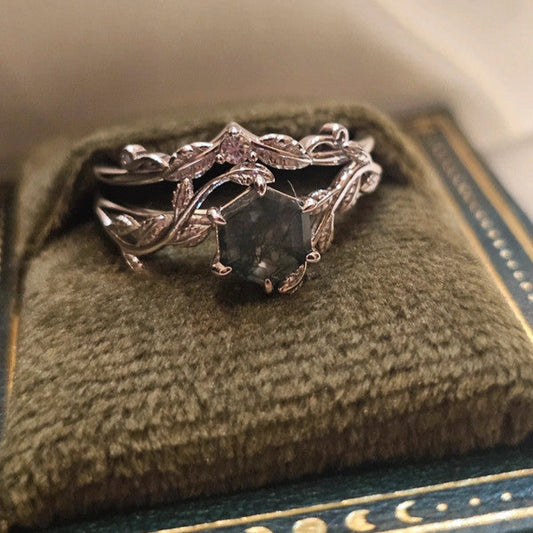 Moss Agate bridal ring set ring with a natural moss agate gemstone on a green cushion in a jewelry box.