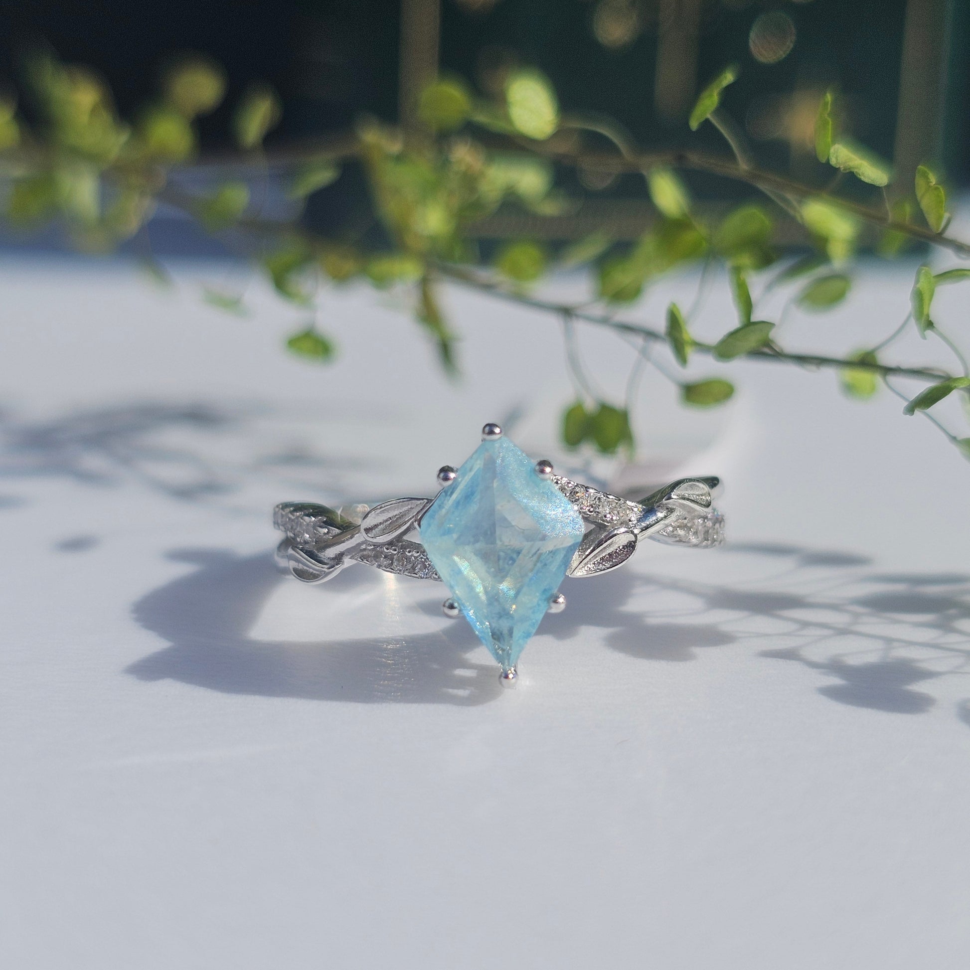 925 silver ring blue aquamarine gemstone on a light background