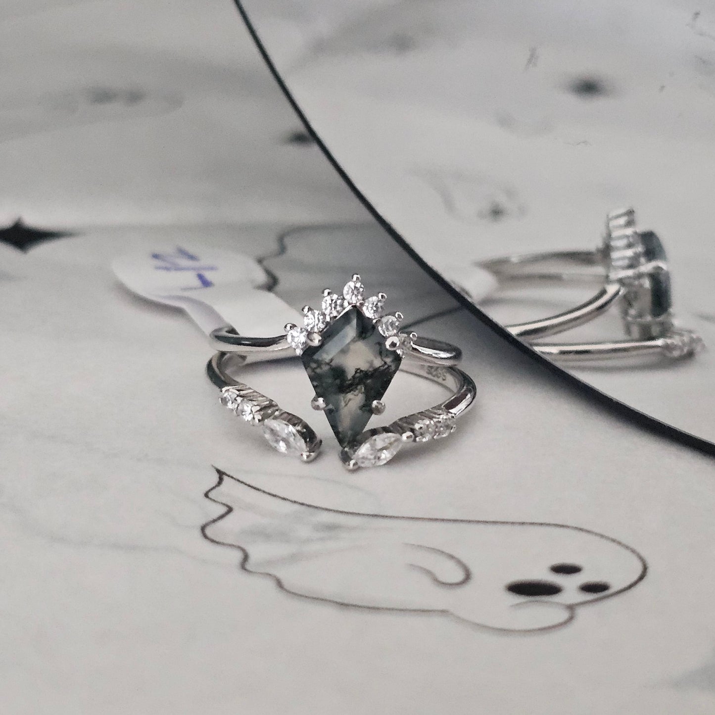 moss agate ring on Halloween themed surface
