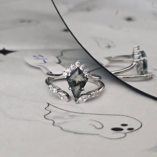 moss agate ring on Halloween themed surface
