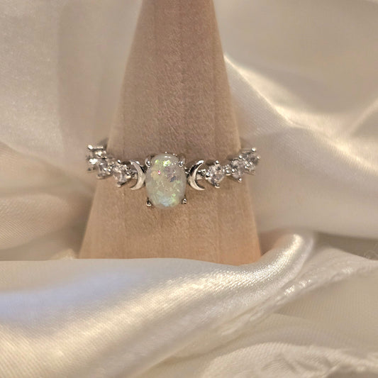 Opal riing on silk background
