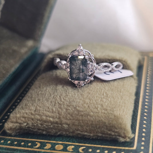 Silver ring with a natural moss agate stone in a celestial book-style gift box
