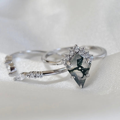 Silver ring with a diamond on a white background