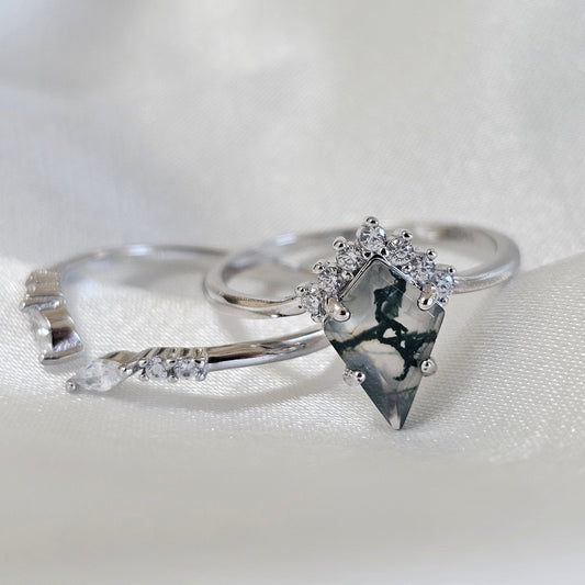 Silver ring with a diamond on a white background