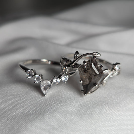 Silver earring with herkimer diamond quartz stones on a neutral background
